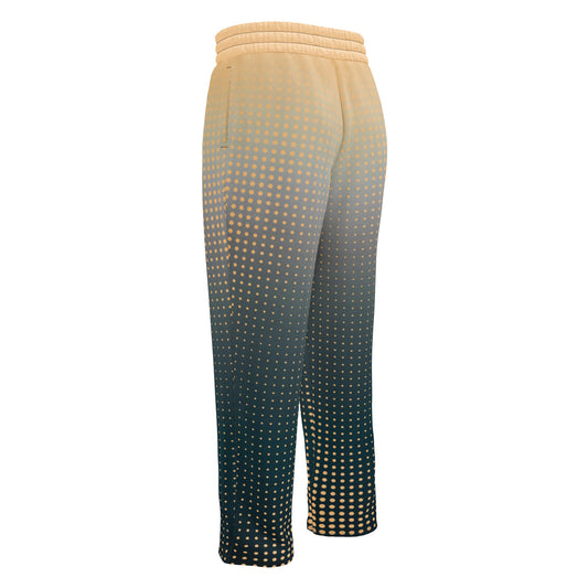 A pair of super soft unisex style wide leg jogger with a ombre pattern that starts as a light orange on the top the fades to a deep teal in the middle of the sweats, there is a polka dot pattern that is light orange throughout the top as well.