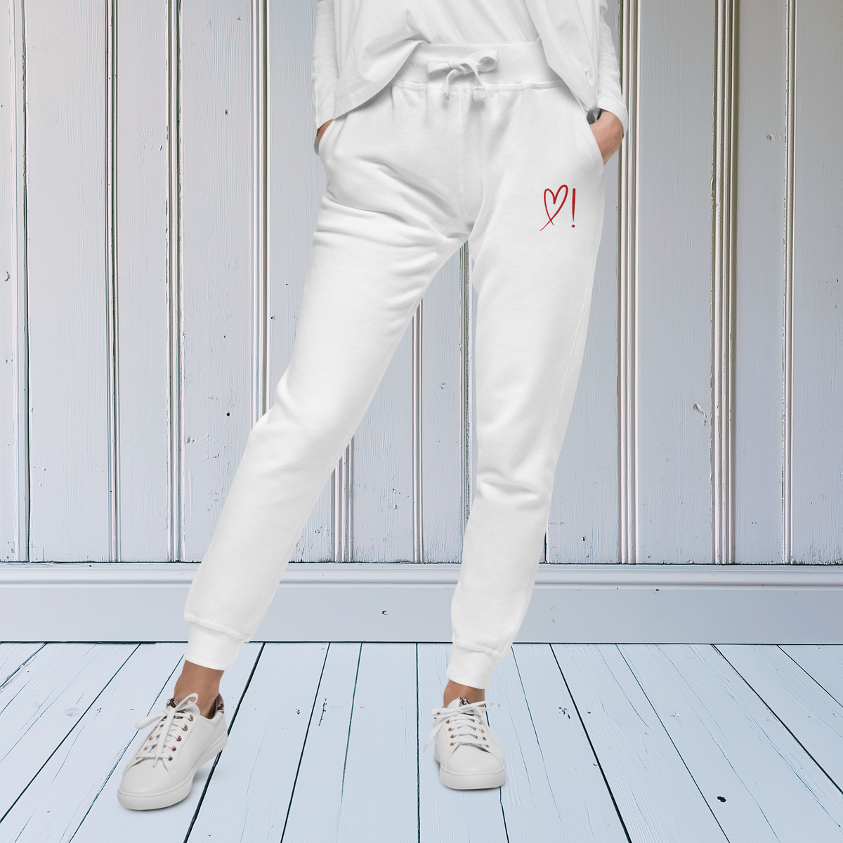 On the front of these fleece lines sweatpants, over the left front pocket is a red heart and exclamation mark that are embroidered into the pants, perfect for everyday pants.