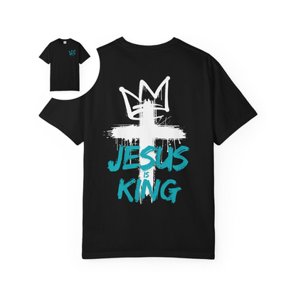 A oversized graphic t-shirt with an image of a crown spray painted on the top right chest of the shirt, on the back of the shirt is a large cross spray painted on the back with a cross on the top with the words 'Jesus is King' spray painted on the top.