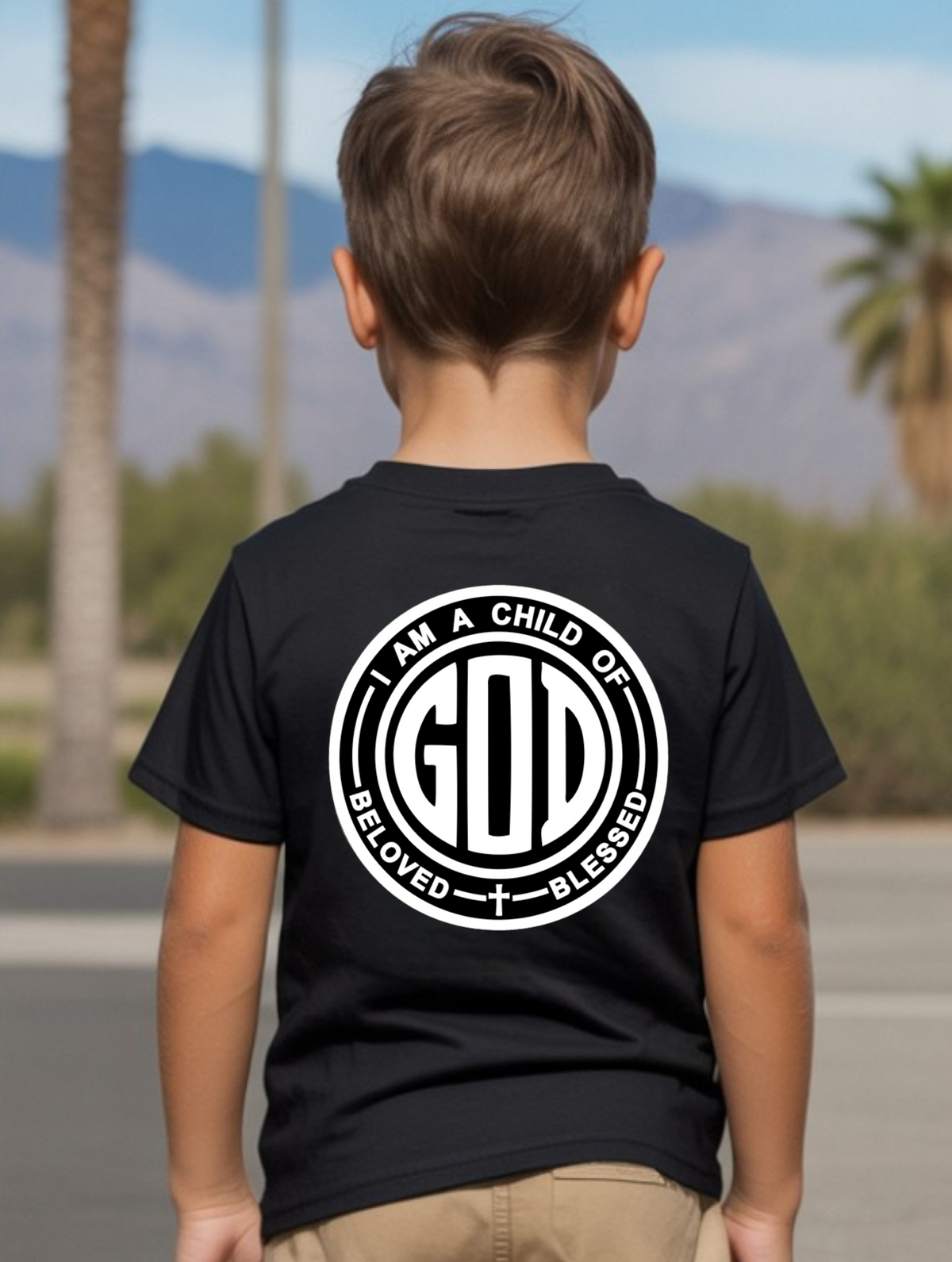 A youth t-shirt with the words 'I am a Child of God Beloved and Blessed' on the back of the shirt.
