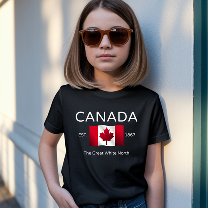 On the front of this youth t-shirt are the words Canada in large letters with a Canadian flag underneath, the letters Esrt1867 and the great white north are under the flag.