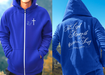 On the front of this Christian zip up hoodie is an image of a Jesus cross with music notes coming from the top of the cross, on the back of the hoodie are the words 'The Lord is my strength and my song Psalms 118:14 with music notes on either side of the image.