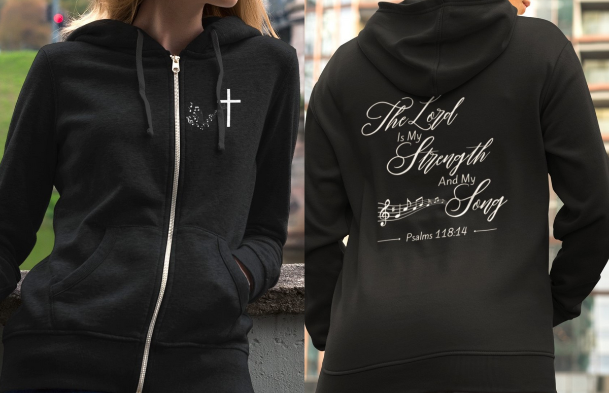 On the front of this Christian zip up hoodie is an image of a Jesus cross with music notes coming from the top of the cross, on the back of the hoodie are the words 'The Lord is my strength and my song Psalms 118:14 with music notes on either side of the image.