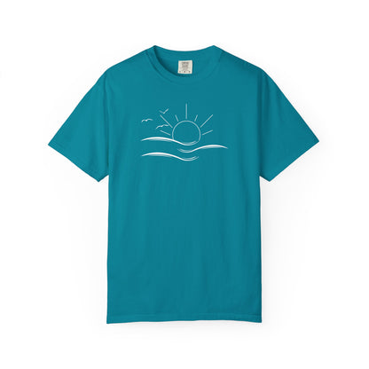 an oversized blue t-shirt the image on the front is a simple line drawing of waves and a sun with birds flying around the sun.