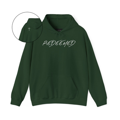 A green hoodie with the words redeemed on the front center, a Jesus cross is on the back left shoulder of the hoodie.