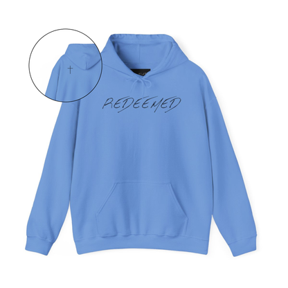 A blue hoodie with the words redeemed on the front center, a Jesus cross is on the back left shoulder of the hoodie.