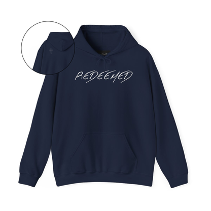 A navy hoodie with the words redeemed on the front center, a Jesus cross is on the back left shoulder of the hoodie.