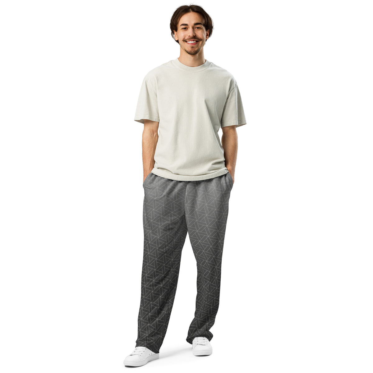 A pair of wide leg sweatpants that are grey ombre in color with a white diamond pattern overlayed on the top.