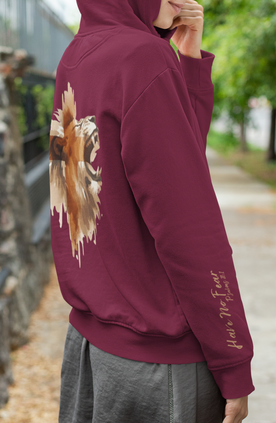 A Christian hoodie with the words Have No Fear Psalms 27:1 on the right sleeve cuff of the hoodie, there is a large image of a lion of the back of the hoodie 