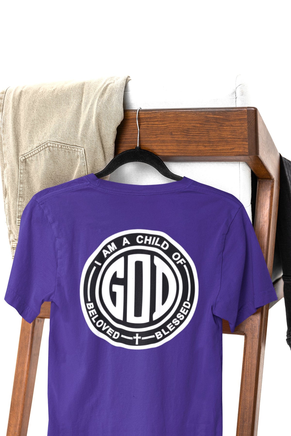 A youth t-shirt with the words 'I am a Child of God Beloved and Blessed' on the back of the shirt.
