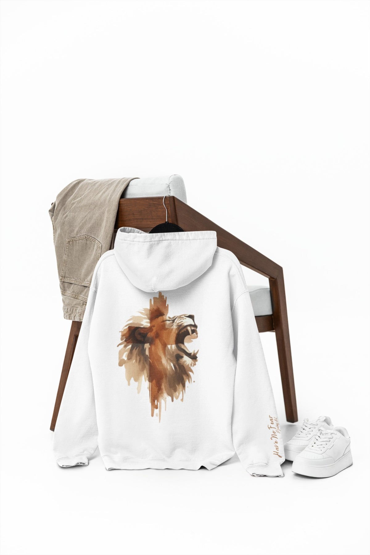 A Christian hoodie with the words Have No Fear Psalms 27:1 on the right sleeve cuff of the hoodie, there is a large image of a lion of the back of the hoodie 