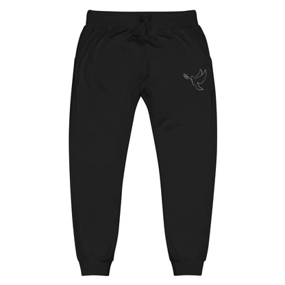 A pair of fleece lined mid rise skinny leg sweatpants with an embroidered silver dove carrying a fig leaf over the left front pocket of the pants.