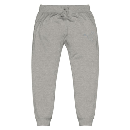 A pair of fleece lined mid rise skinny leg sweatpants with an embroidered silver dove carrying a fig leaf over the left front pocket of the pants.