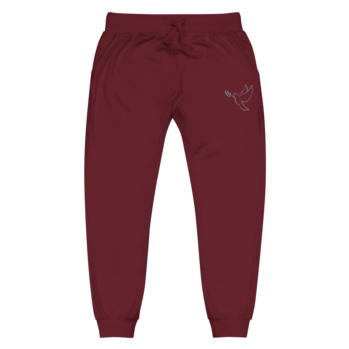 A pair of fleece lined mid rise skinny leg sweatpants with an embroidered silver dove carrying a fig leaf over the left front pocket of the pants.