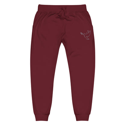 A pair of fleece lined mid rise skinny leg sweatpants with an embroidered silver dove carrying a fig leaf over the left front pocket of the pants.