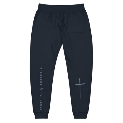 A pair of fleece lined sweatpants that have the words Stronger With Jesus on the back left leg of the pants, on the right leg is a large Jesus cross